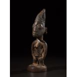 Yoruba -Nigeria Ibeji sculpture.Hardwood with dark patina, fibers, beads and pigments.Defects, sig