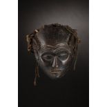 Chokwe - Angola, Zambia Chihongo mask.Hard wood with dark patina, branches, fibers, fabric, rope, p