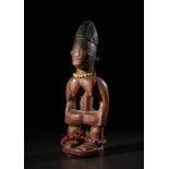 Yoruba -Nigeria Ibeji single.Hardwood with reddish patina, beads, metal and pigments.Signs of use.