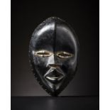 Dan - Costa d'Avorio/Liberia Dan Mask.Hard wood with glossy patina, black pigment and metal.Signs o