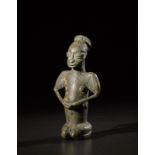 Yoruba -Nigeria Seated figure Edan.Bronze with green patina.Minor casting defects and usage marks.