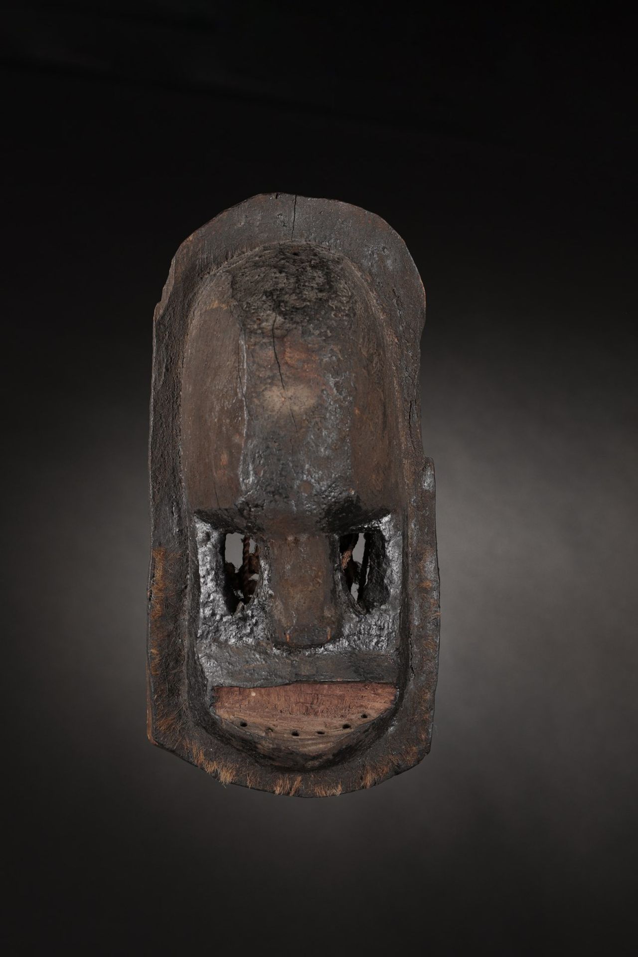 Dogon - Mali Black monkey mask.Hardwood with dark patina, bitumen and pigments, animal hair and fi