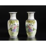 A pair of famille rose porcelain vases painted with courtly scenes China, 20th century Cm 29,00