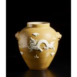 A beige glazed porcelain vase with relief decoration China, Qing dynasty, 19th century Cm 28,00 x