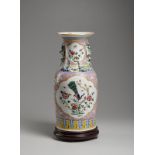 A porcelain baluster vase over pink ground China, 20th century Painted with peacock and phaesant