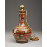 A polychrome porcelain bottle vase China, 20th century Enamelled with auspicious symbols within