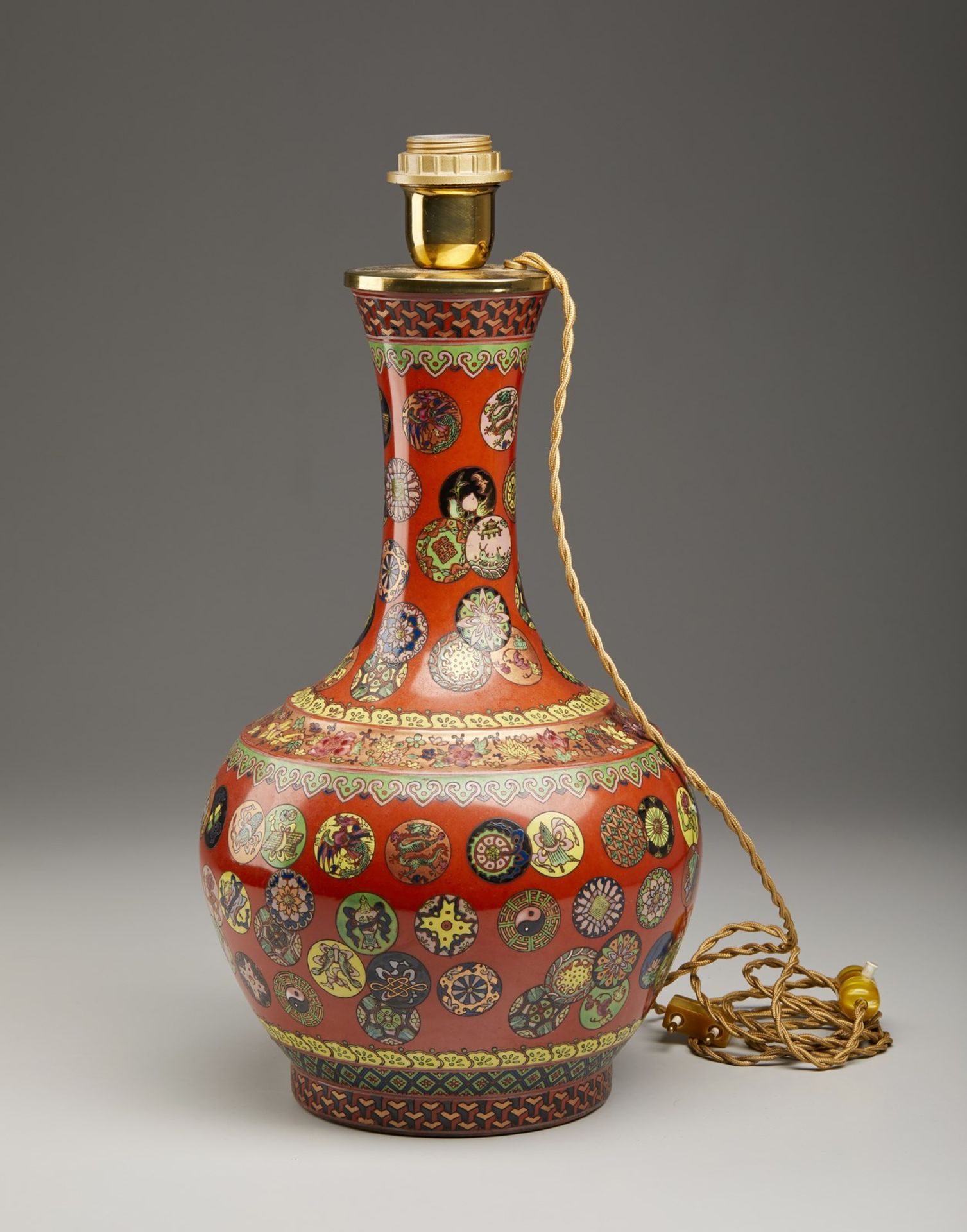 A polychrome porcelain bottle vase China, 20th century Enamelled with auspicious symbols within