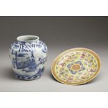 A blue and white pottery jar and a yellow ground enamelled porcelain dish China, 20th century Cm