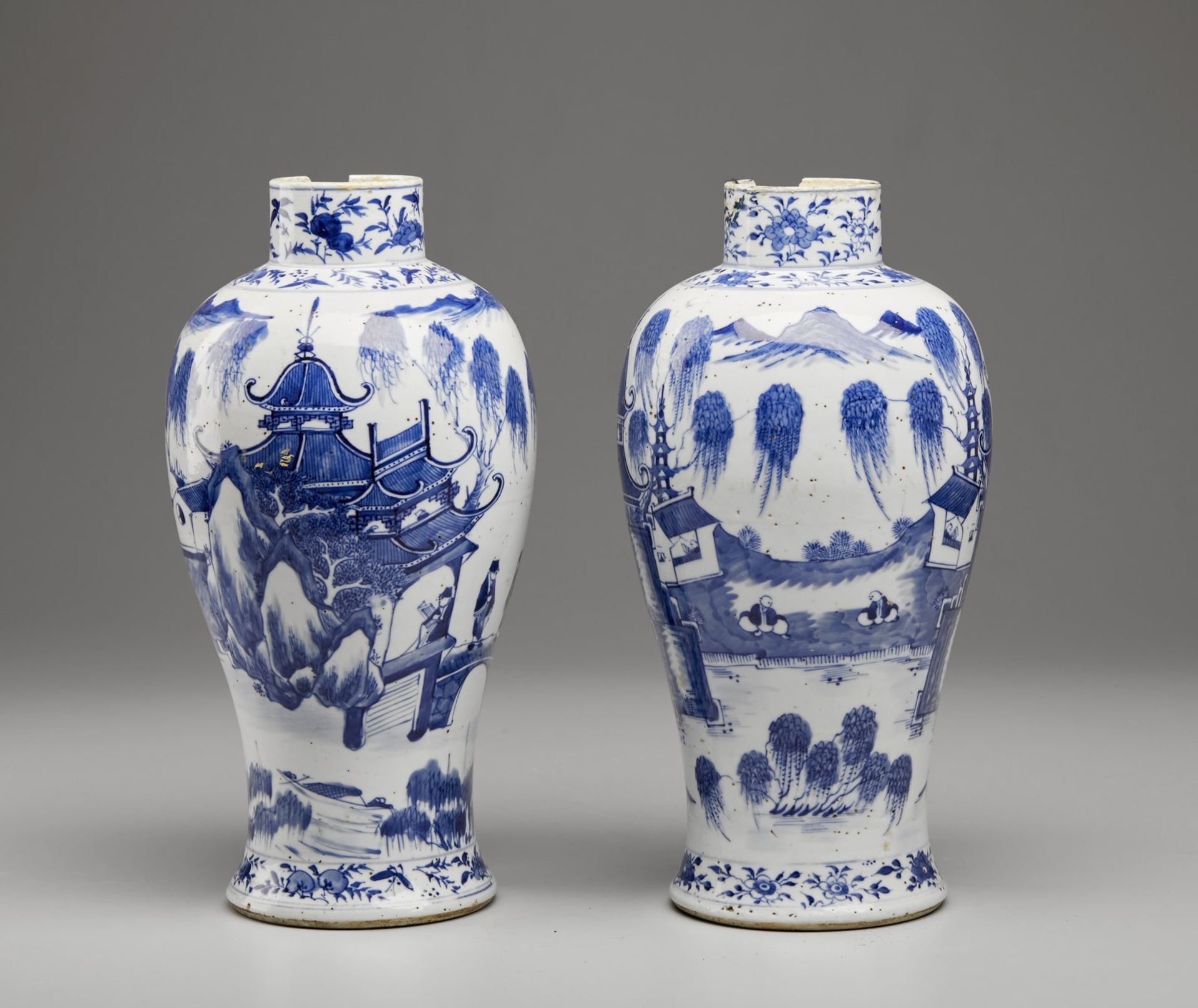 A pair of blue and white porcelain baluster vases bearing a four character mark at the base China,