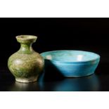 Two pottery vessels China, Ming dynasty, 15th century Including: A green glazed Han bottle vase