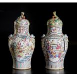 A pair of famille rose porcelain vases and covers decorated with characters China, Qing dynasty,