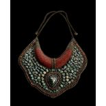 A turquoise and coral breastplate Ladakh, early 20th century Cm 25,50 x 23,00