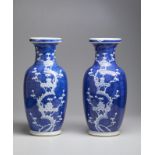 A pair of blue and white porcelain baluster vases China, 20th century Cm 15,00 x 47,00