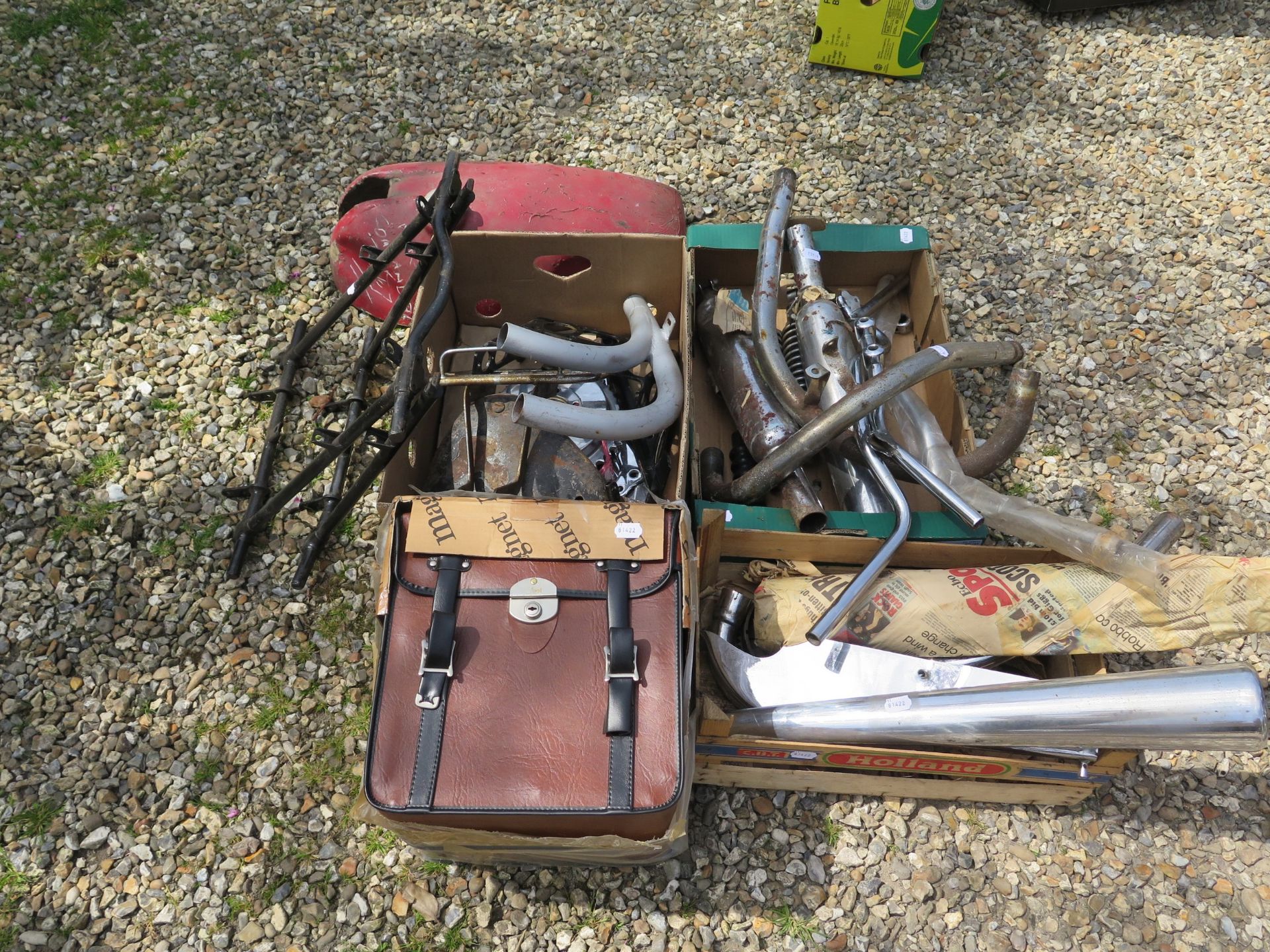 Assorted leather panniers, exhausts, handlebars and items Being sold without reserve