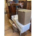 A white dressing table, 129 cm wide, a Lloyd Loom chair and matching basket, a demi lune table,