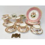 A set of six late 19th century cup and saucers, decorated flowers, highlighted in gilt, and assorted