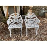 A pair of Coalbrookdale style painted metal fern pattern arm chairs (2)