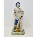 An early 19th century Staffordshire figure, of Plenty, 19 cm high Some small losses round exposed