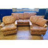 A red and gold three seater sofa, 230 cm wide, and a pair of armchairs (3)