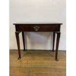 A 19th century mahogany side table, with a single frieze drawer, on carved turned legs to pad