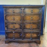 An oak chest, having two short and three long drawers, 106 cm wide