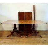 A mahogany twin pedestal dining table, with two extra leaves Top is 188 x 122 cm, and the leaves are