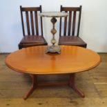 A mahogany breakfast table, 105 cm diameter, a modern coffee table, 117 cm wide, two oak chairs, and