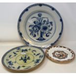 A Delft plate, decorated flowers, 31 cm diameter, three other Delft plates, and a plate (5)