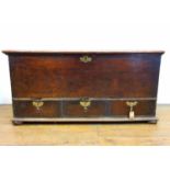 An 18th century oak mule chest, with a hinged top, above three drawers, 123 cm wide