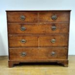 An oak chest, having two short and three long drawers, on bracket feet, 102 cm wide Split to top and