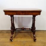 A 19th century walnut folding card table, on a twin end support to splayed legs, 90 cm wide Light
