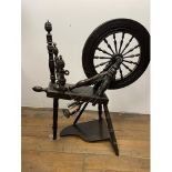A 19th century oak spinning wheel, 58 cm high, a trunk, 92 cm wide, another trunk and assorted