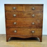 An oak and mahogany crossbanded chest, having two short and three long drawers, 96 cm wide, and a