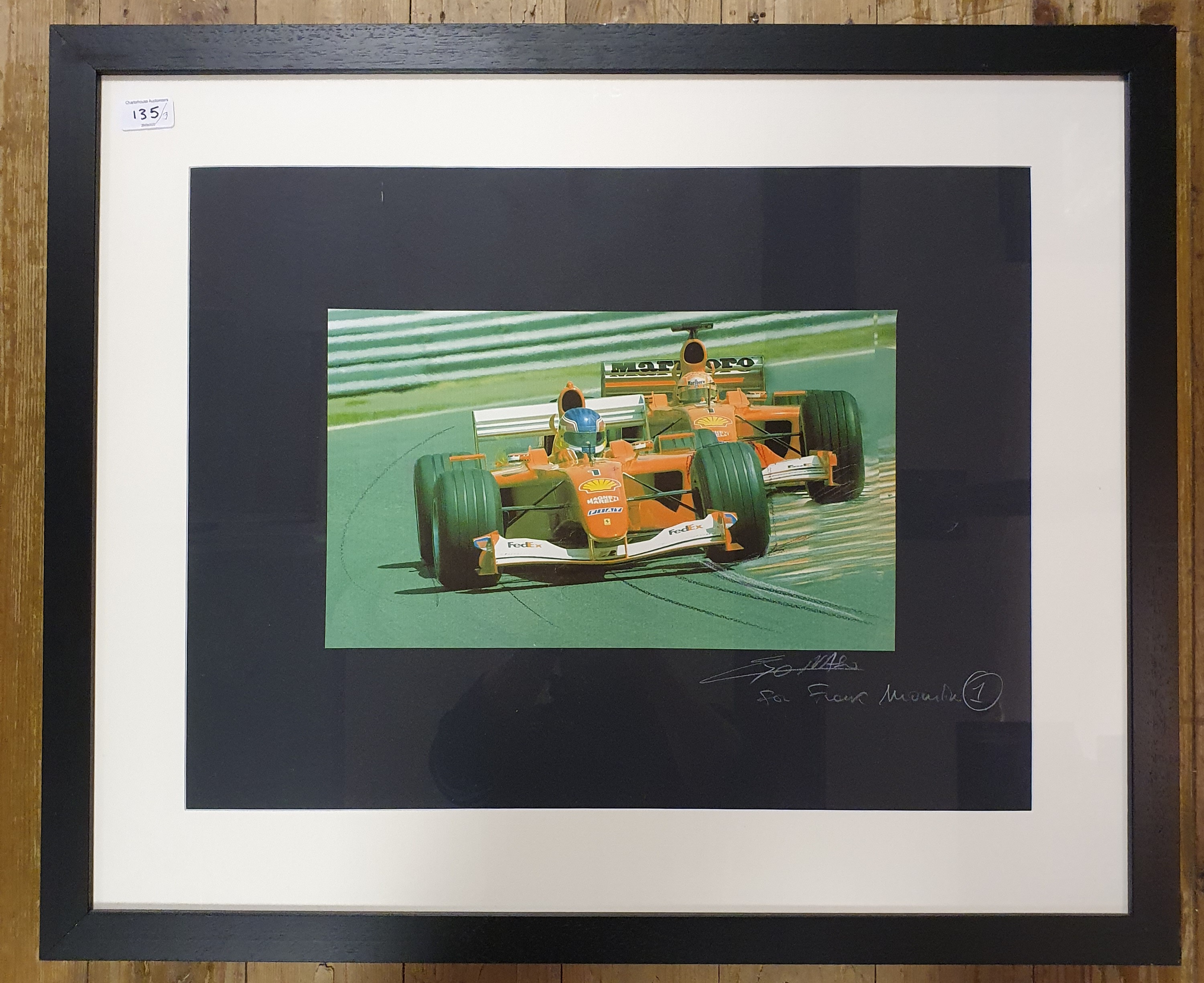 A Formula One Ferrari print, inscribed 'For Frank Mountain', 45 cm x 60 cm