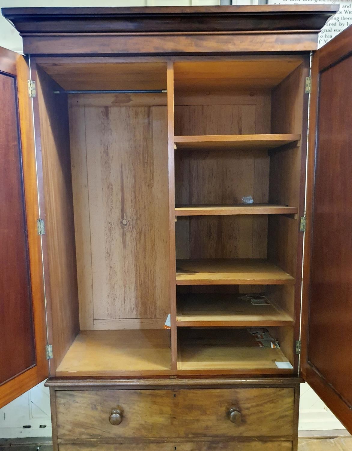 A 19th Century mahogany linen press, two cupboard doors to reveal shelves, on a base with two - Bild 4 aus 4