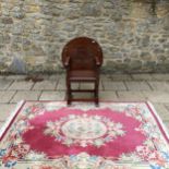 An oak chair table, and a Chinese rug (2)
