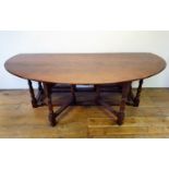 A large 18th century style oak double gateleg table, 230 cm wide Overall condition good, just