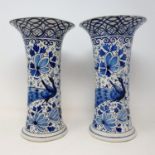 A pair of Delft vases, 28 cm high (2) Some losses