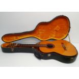 An acoustic guitar, Yoshima, Model 3, with Spanish Guitar Centre London label, with carrying case