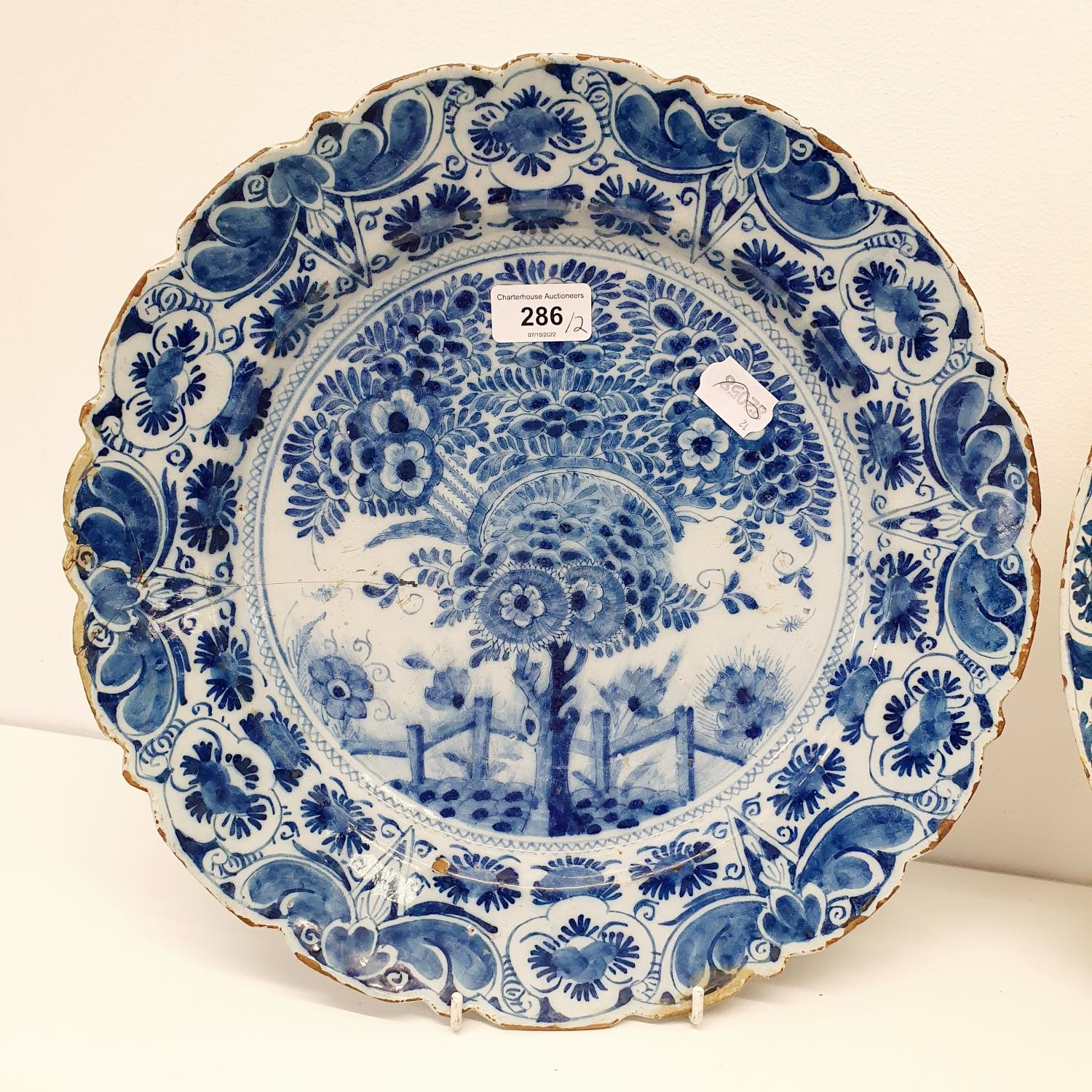 A 19th century blue and white Delft plate, 35 cm diameter, and another, 35 cm diameter (2) The - Image 2 of 5