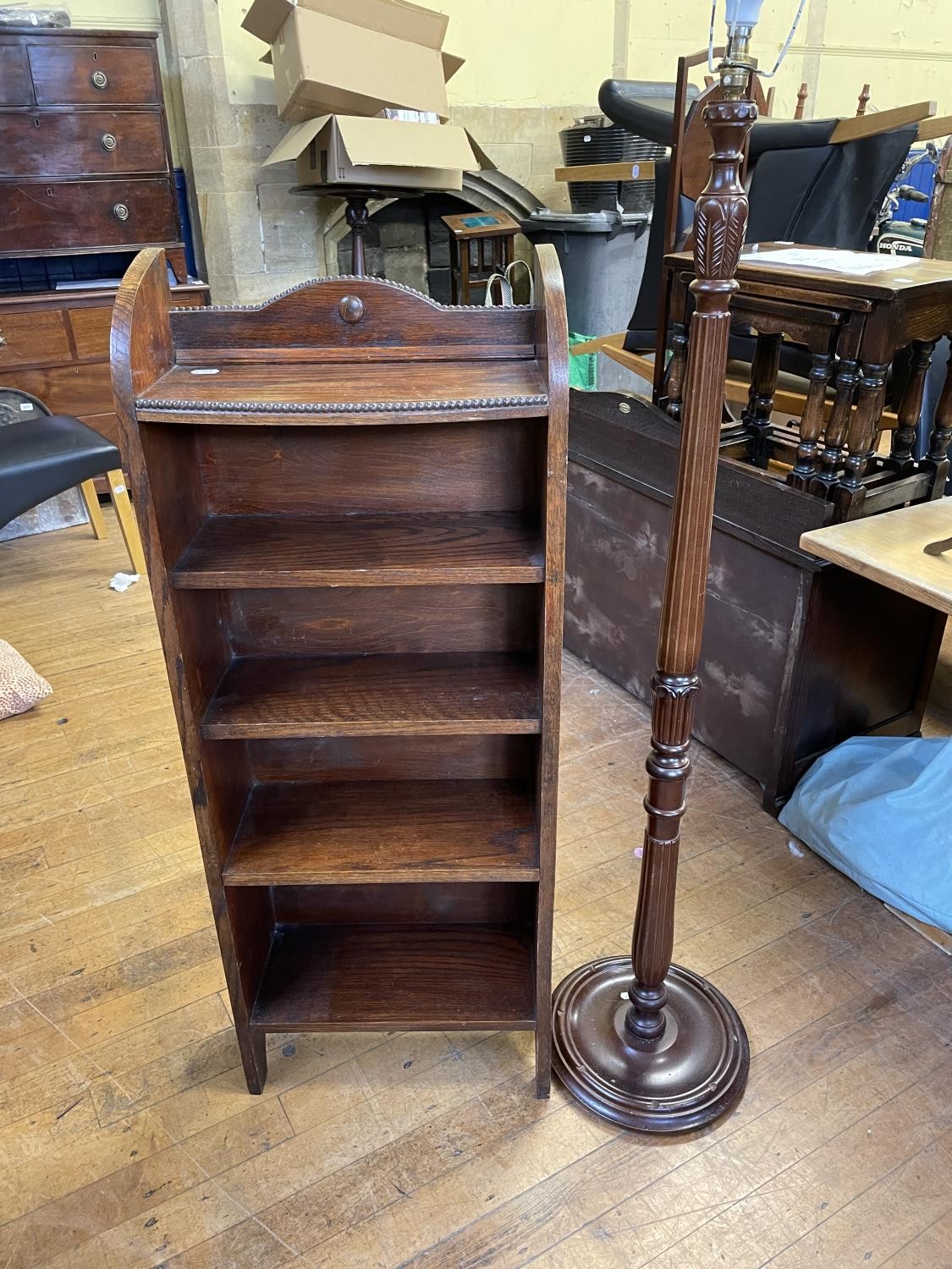 An oak glazed bookcase, 61 cm wide, two other bookcases, an oak drop leaf table, an oak tray, a