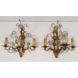 A set of three brass and glass wall lights, with drops (3)