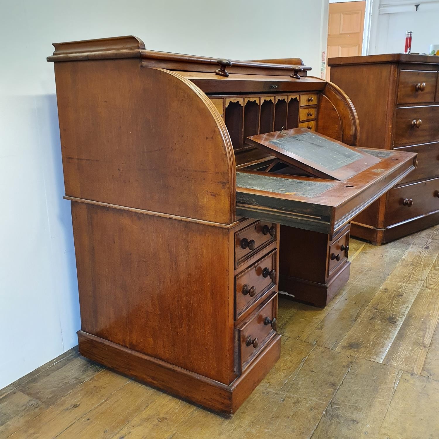 A 19th century mahogany cylinder desk, with a fitted interior, on a base with six drawers, 122 cm - Image 4 of 6