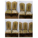 A set of seven Carolean style dining chairs, with padded backs and seats, on carved cabriole legs,