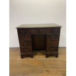 A mahogany kneehole desk, 91 cm wide