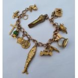 A 9ct gold charm bracelet, with assorted charms, 42.7 g (all in) Confirming we have added your bid