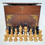 A turned wood chess set, and an oak smokers companion, 33 cm wide (2)