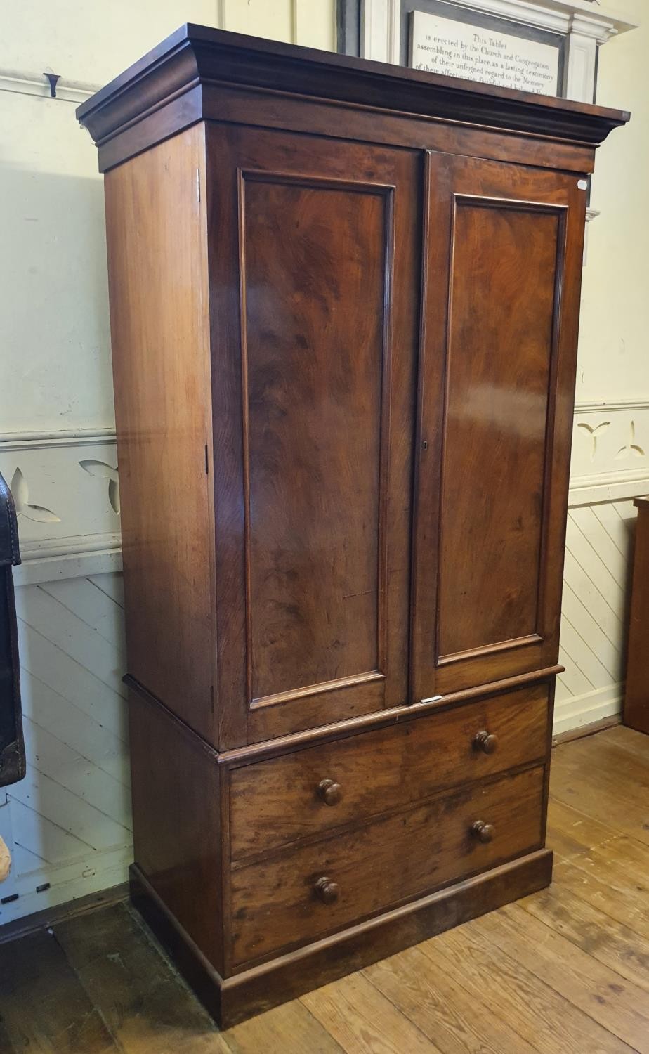 A 19th Century mahogany linen press, two cupboard doors to reveal shelves, on a base with two - Bild 2 aus 4