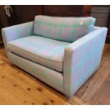 A modern two seater sofa, in turquoise and purple, 129 cm wide