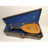 An 8 course lute, made by Anthony S Campbell, with carrying case